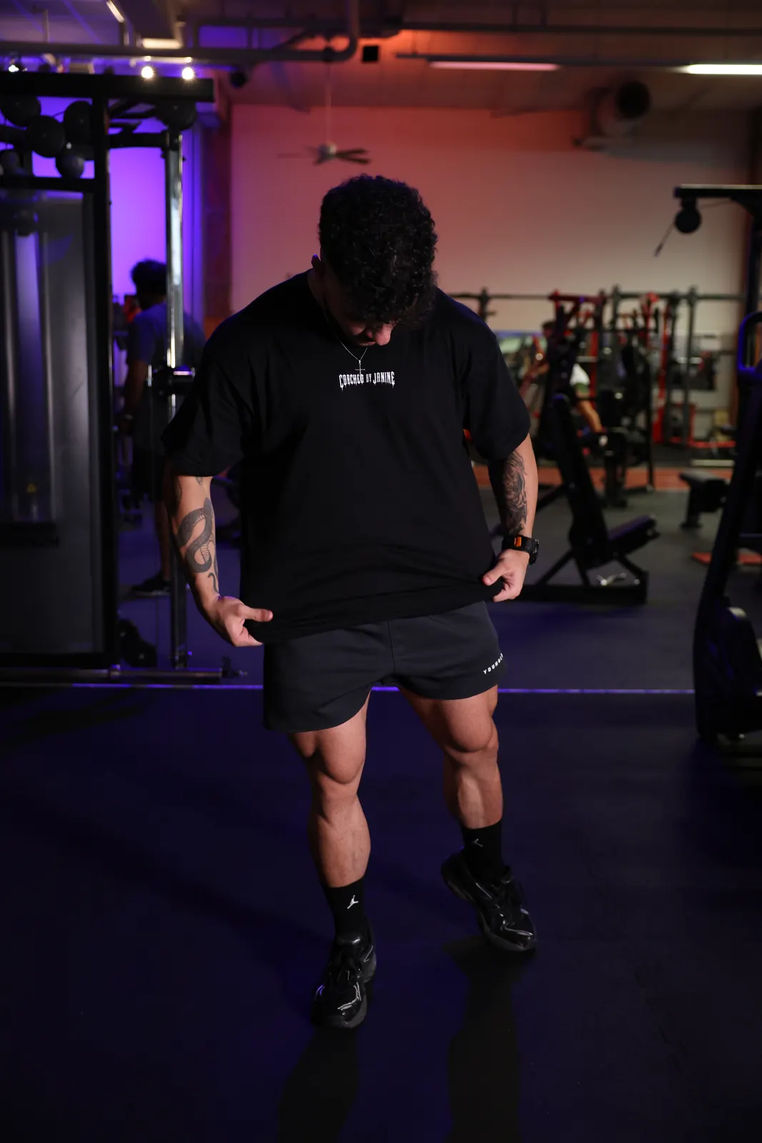Front view, looking down at the tee — boxy fit over training shorts
