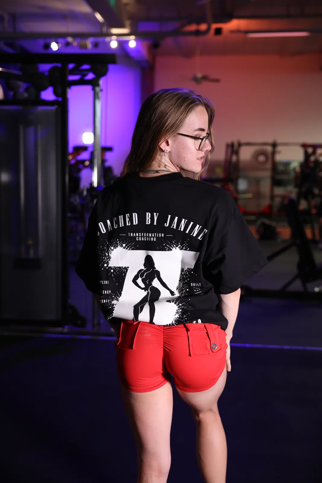 Standard Edition back print half-tucked over red shorts