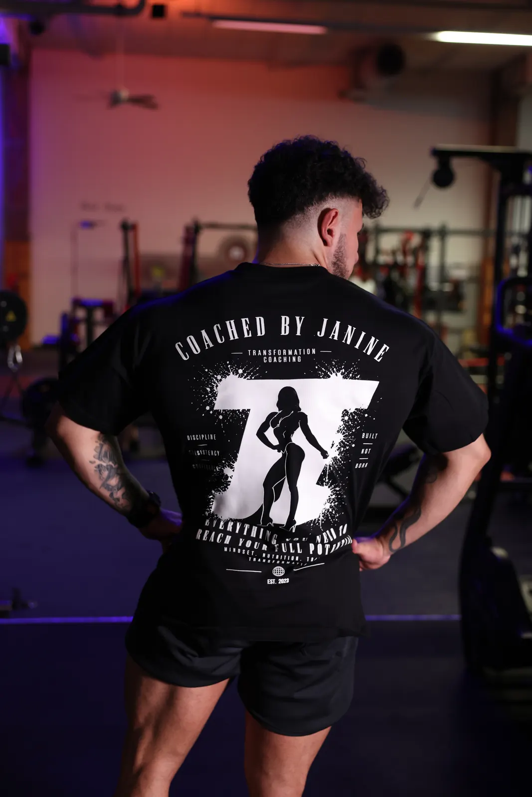 Standard Edition back print worn oversized between the machines — print fully legible